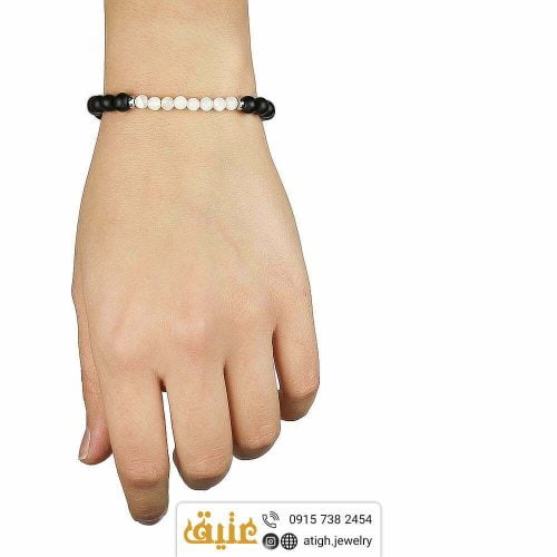 دستبند بافت صدف و عقیق سیاه (انیکس) معدنی و حدید مکعبی‌ | سایت جواهری عتیق: atigh.jewelry
